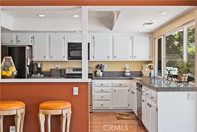 Kitchen has ample space for creating your culinary dreams. Freshly painted cabinets and updated counter tops.