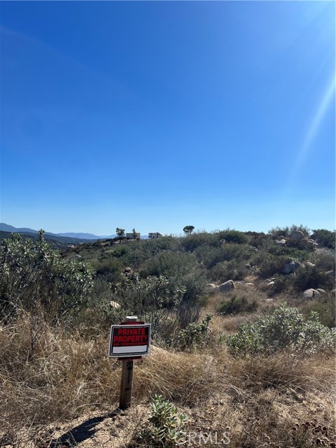 view of the property from the road facing SW