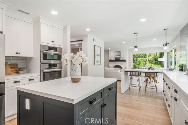 Walk-in pantry is adjacent to the kitchen, across from oven and breakfast bar.