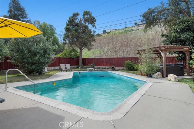 Fenced in HUGE backyard with lawn, pool and deck