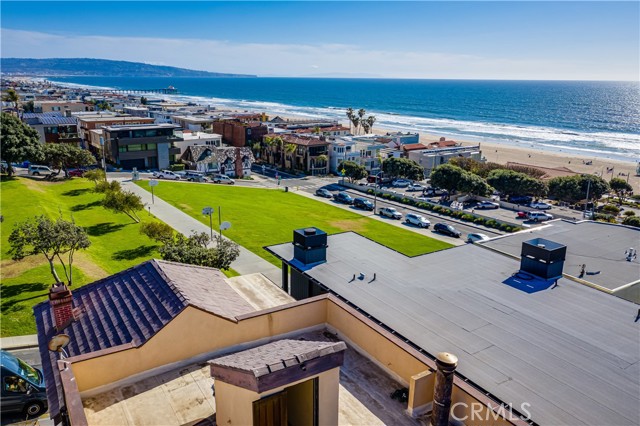 219 27th Street Manhattan Beach, California The ultimate ocean view experience is now available for buyers looking to create their dream home or remodel a classic beach property. Just a few steps from The Strand and the wide beaches of Manhattan Beach, 219 27th Street is situated on one of the most ideal view streets in all of the South Bay. This south facing home captures coastline views from the main bedroom, the living room and the upper roof/deck area. Unlike other view properties, these views capture Palos Verdes Peninsula, Catalina, the Manhattan Beach Pier, Hermosa Beach Pier and from the roof/deck area, you can see all the way to Malibu and Point Dume. Located just north of downtown Manhattan Beach, you can walk to the shops and restaurants near the Manhattan Beach Pier or North Manhattan. Award winning Grand View Elementary School is a short walk away for those looking to embrace the best in class Manhattan Beach schools. This duplex property consists of 219 and 221 27th Street, which includes the front three bedroom and two bathroom home and the rear two bedroom and two bathroom home with an ocean view and small yard. This property has many possibilities, ranging from remodeling the existing home to live in one unit and rent out the other, to maintaining a trophy rental property for long term upside, or to build your dream home.