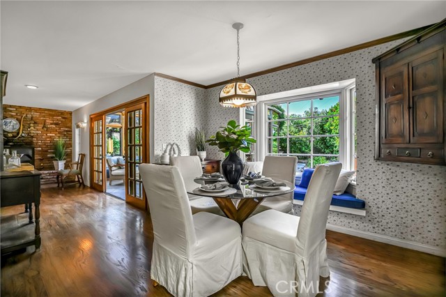 Dining room has a bay window and opens to living room