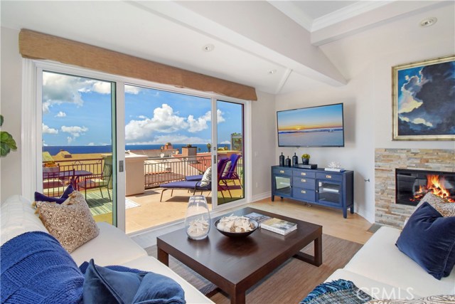 2429 Silverstrand Avenue Hermosa Beach, California A true trophy property just two blocks from the sand on one of Hermosa’s most desirable streets. The open living space on the main level is private and warm, but at the same time capitalizes on dramatic ocean views, abundant light and the local climate. Rich details such as wood floors, large windows, and curved archways make this a remarkable home in every way. The open kitchen has Quartz counters, floating shelves, solid red oak cabinetry, and cooking island. A cozy seating area and breakfast bar make the kitchen perfect for relaxed entertaining. Just beyond is a formal dining area and breezy living area with a fireplace and windows to take in stunning coastal sunsets. Step through oversized sliding doors to a generous patio w/ocean views and ample room for a seating area and grill. The easily accessible rooftop deck is where you’ll find even more breathtaking coastline views. One level below is the master bedroom with a fireplace, private patio and huge bathroom with a soaking tub. Adjacent is a room perfect for a home office or gym. On the lower level are 3 additional bedrooms, 2 of which open to a private stone covered rear yard. With local classics like Martha’s, the Green Store & The Bottle Inn just a quick walk away, the home’s location in this iconic beach town will keep you close to some of the best stretches of sand in Hermosa Beach while nestled away from the crowds.