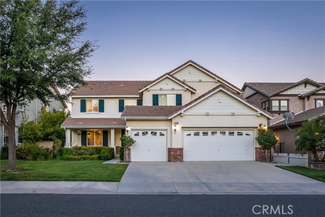 29350 Las Brisas Road Valencia, California Welcome to this immaculate Huntington Collection home in the highly sought-after Tesoro Del Valle neighborhood! Immediately notice the attractive curb appeal with the beautifully landscaped front yard, welcoming porch with sitting area and the grand double door entry. Walk in and experience nearly 3,500 sq. ft. of open living space with 5 bedrooms (1 down,) 3 baths, formal step-down living and dining room, great room, laundry room, huge kitchen and a 3 car garage. Experience cathedral ceilings in the entry, beautiful tile and hardwood flooring throughout the downstairs, new lush carpeting upstairs, designer touches throughout, new relaxing paint selections, custom window treatments, coordinating cabinetry and counters, recessed lighting and huge windows filling the spaces with natural light. The expansive kitchen includes freshly painted white cabinetry with several glass display cabinets, granite counters with seamless backsplash, large island, coffee bar, and a massive walk-in pantry! The formal dining room has plenty of room to host large gatherings and is accented by a gorgeous chandelier. The great room includes a cozy fireplace, views of the beautiful backyard and newer modern ceiling fan. The downstairs bath is adjacent to the downstairs bedroom, perfect for guests or in-laws. The huge Primary Suite features a double door entry, retreat, romantic balcony with city light views and a large walk in closet. The spa inspired ensuite bath includes dual sinks, large soaking tub, separate shower & extensive and convenient linen storage. The secondary bedrooms are generous in size and have ample closet space. The hall bath has dual sinks, tiled counters and separate shower room. Saving the best for last...Walk outside and and find a fabulous entertainer's space with large covered patio, gorgeous landscaping, several areas for relaxation and outdoor dining. Enjoy the conveniences of being just minutes from multiple shopping centers, parks, award winning schools, public transportation and easy access to the freeway.