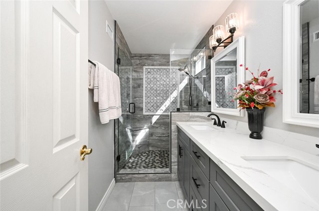 Tile flooring and quartz countertop.