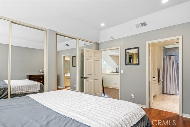 Master Bedroom with Wall-length Mirrored Wardrobe Closet