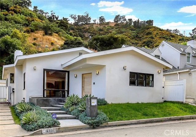 1633 N Beverly Drive Beverly Hills, California AVAILABLE FOR LEASE AS WELL AT $12,000 A MONTH. Proud to introduce this fully furnished modern luxury Beverly Hills residence! Upon entering, be amazed by the abundance of natural light coupled with near 11 ft high vaulted ceilings. Tastefully updated with contemporary finishes featuring beautiful hardwood floors, trendy wet bar with built in wine fridge and high-quality surround sound. The kitchen boasts quartz counters, custom cabinets and stainless steel Viking appliances. The spacious primary bedroom features a true walk-in closet and french doors that lead out to the majestic backyard. The incredible en-suite bathroom features designer standalone bathtub, glass-walled shower and stone-finished dual sinks. Also, the spacious secondary bedroom suite includes a full en suite bathroom for ultimate convenience and function. The backyard has a complete full outdoor Viking kitchen ideal for entertaining guests. You are moments away from Franklin Canyon Park, Coldwater Canyon Park, Beverly Hills Hotel, Sunset Blvd and many more attractions that Beverly Hills has to offer!