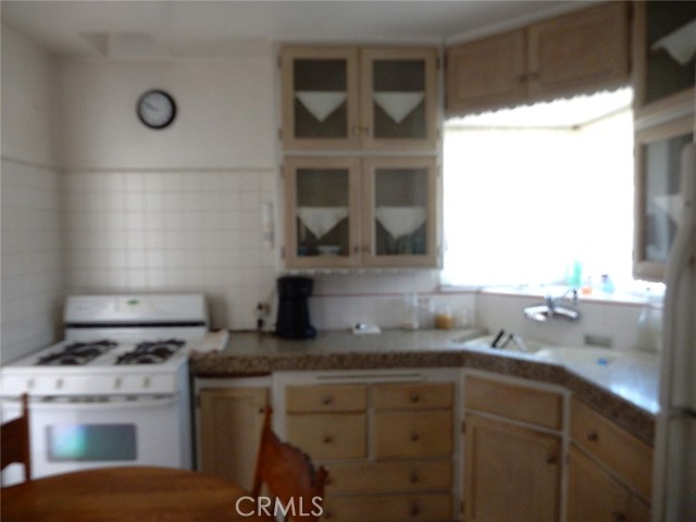 Good sized kitchen located just off the laundry area off the side door.