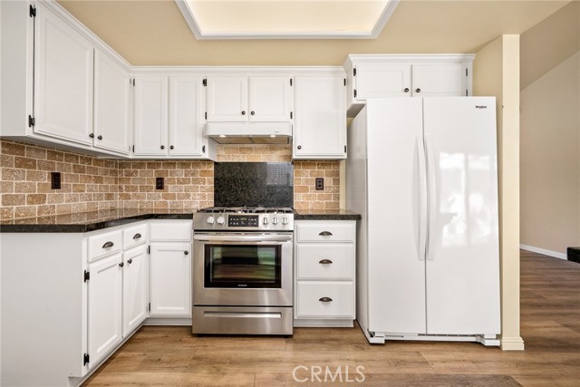 Abundant cabinetry and counterspace!  Refrigerator stays!