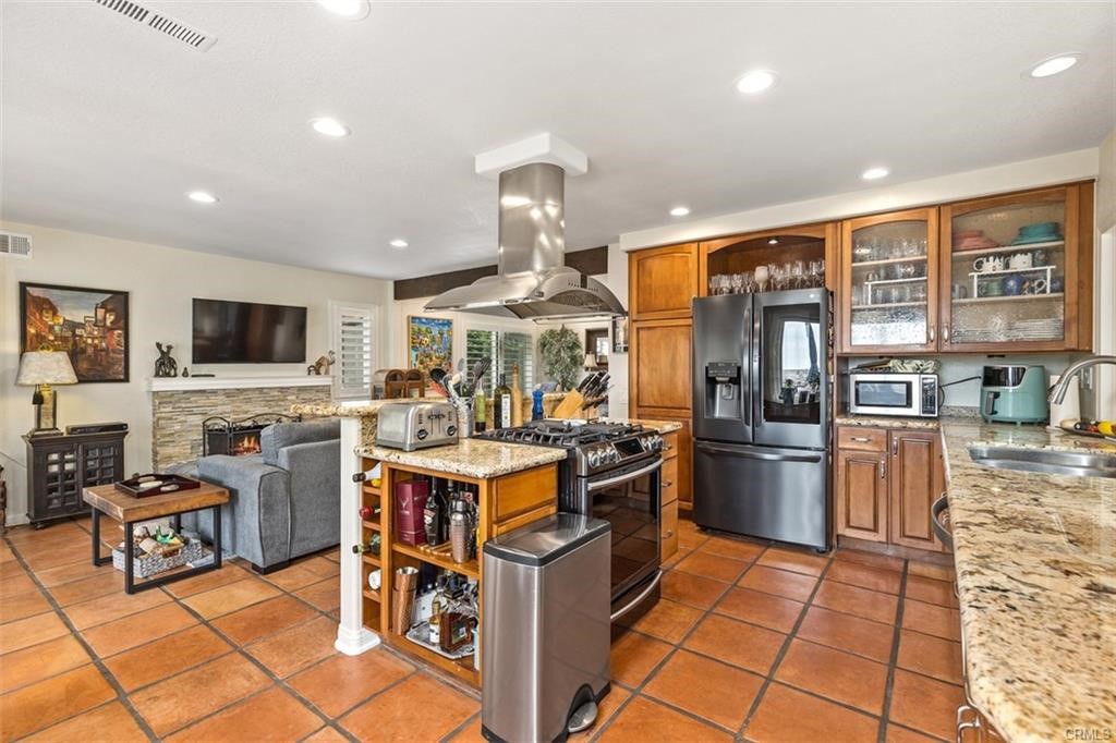 Kitchen is upgraded with granite counter tops, newer stainless steel appliances, and center island.