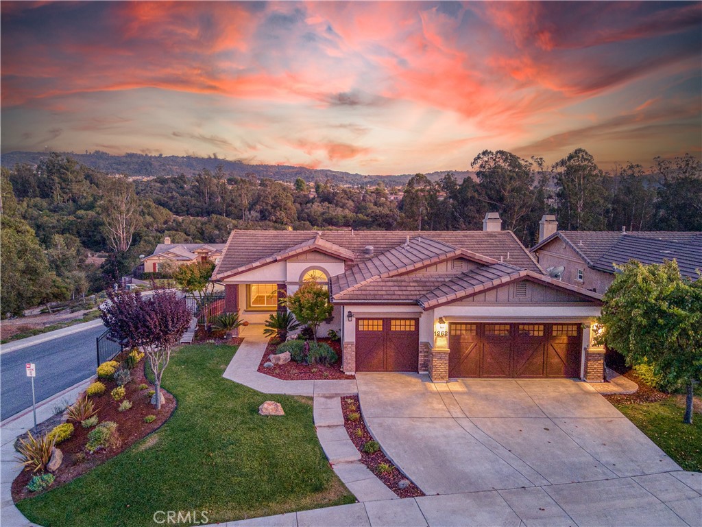 1262 Hollysprings Lane Santa Maria, California Stunning inside and out, this home is situated on a choice corner lot with exquisite unobstructed sunrise to sunset views of the Orcutt Hills. Better-than-new, this spacious home has been upgraded with kitchen and bath remodel, luxury flooring, fresh paint, and skylighted covered patio. Four spacious bedrooms, include an elegant master suite featuring deep walk-in closet and oversized spa-style bath. Versatile family room is suitable as den, study, and entertainment area open to extensive backyard covered patio. Finished 3-car garage adds to the value of this great home. The development adjoins the extensive Orcutt hiking/nature trails and is close to acclaimed schools, stores, Old Towne Orcutt. Enjoy year-round comfort with central A/C and a resort lifestyle in this magnificent property.