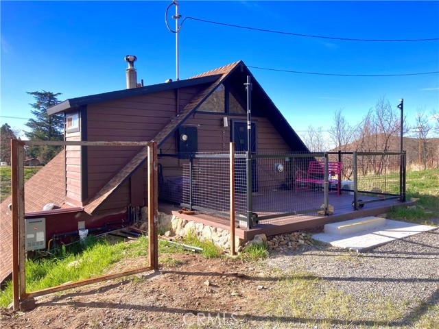 8181 Bluff Street Banning, California This is a beautiful A-Frame house Banning Bench offering with a Elevation 4200’ sits mountain views. Home was completely remodeled in 2019 that has lots of nice upgraded throughout and it offering with 2 bedrooms, 2 bathroom, living room with great fireplace to keep you nice and warm with cathedral V frame high ceiling, kitchen with island, laundry room, large nice size nice deck on the backyard that has a great view hills and mountains with storage space detach from house, SQFT 1,224, lot 37,462, BLT 1973. Here are some of the items that home has to offer propane heat, instant hot H2O, high efficiency heat pumps, new wood burning fireplace, EV Level 2 charging outlet, powered air system feeds filtered (MRV 13) air, heat pumps will warm as need to warm up home, 40’ X 35’ space for RV parking with 220V power, solar powered electric gate, there are 2 separate entrance and exit points, one for the main level and one for the loft & more. Close to Palm Spring, Outlet, Casino. Having the feel of the country and peace of the nature around the home. Lots to see, must see.