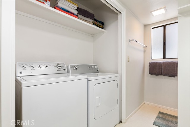 Downstairs laundry in bathroom.