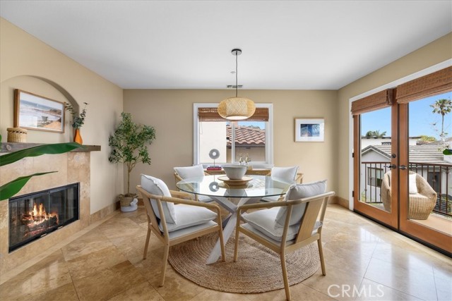 Dining room w/french doors leading to outdoor balcony