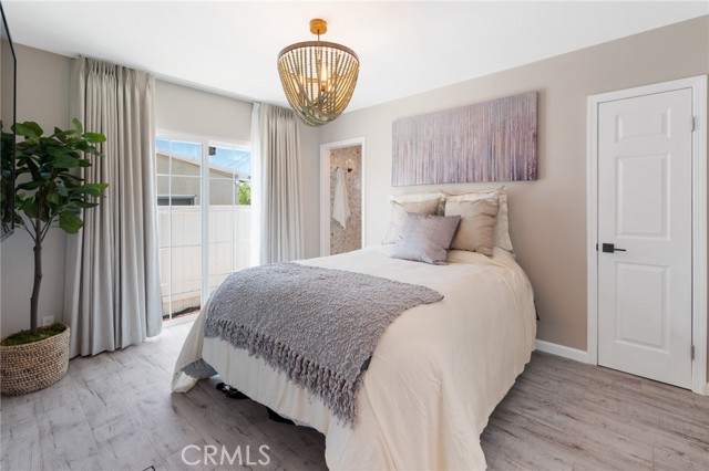 Main bedroom with new flooring, paint and brand new custom drapes and curtains.