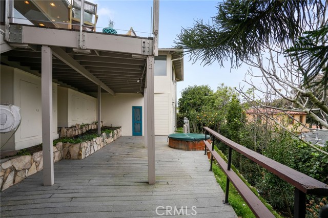 Exterior storage areas underneath upper balcony and under exterior staircase
