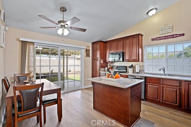 Kitchen has direct access to the backyard's LARGE covered patio. Will you be dining inside or al-fresco?