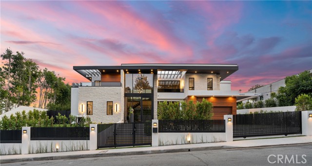 10052 Hillgrove Drive Los Angeles, California Newly Constructed Contemporary Modern Masterpiece located in Beverly Hills post office. Beautifully manicured landscaping and large glass entryway invite guests with high ceilings, and luxurious finishes throughout. An open entry hall with a floating glass staircase sits next to an elegant formal dining room complete with tinted glass wine cabinets. Gourmet Chef’s kitchen with center island and breakfast table complete with stainless steel appliances. An inviting living room boasts a large linear fireplace framed by stone and a wall of pocket sliding glass doors that open up to a large entertainer's backyard. A dedicated office and state of the art media room with starline ceiling complete the first floor. Upstairs the romantic master suite has a large fireplace, private balcony, incredible closet complete with LED lined cabinets, and spa-like bath with accent tile detail, soaking tub,sauna and massive glass steam shower. Spacious guest bedrooms boast private balconies and beautiful baths, offering wonderful accommodations for family and friends. Outside, the incredible entertainer’s yard features a sparkling pool and spa, BBQ center, sunken fire pit and pool house complete with full bath. Additional conveniences include an integrated smart home control 4 system. A truly marvelous home for the most discerning host. Located near luxury shops, fine dining and more.