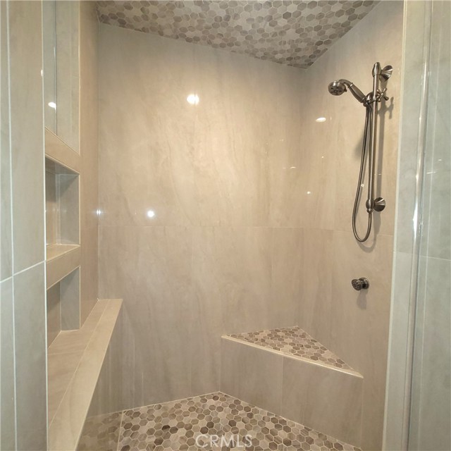 The easy step in shower has been thoughtfully designed with a place to sit, a raised shower bar that can be adjusted to your height, lots of shelf space for your shampoos, soaps, shavers, etc.