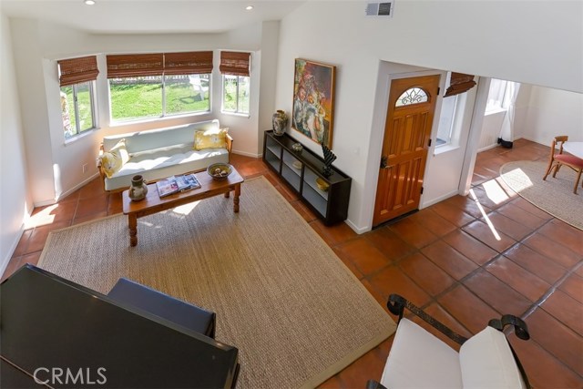 View of the living room and dining from the stairs.