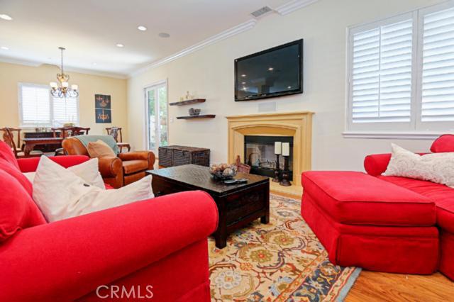 Beautiful hardwood floors, recessed lighting and crown molding with plantation shutters AND a fireplace? Who wouldn\'t want to relax and lounge in this room? Beautiful hardwood floors, recessed lighting and crown molding with plantation shutters AND a fireplace? Who wouldn\'t want to relax and lounge in this room?