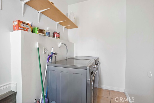 Individual laundry room with door to the garage