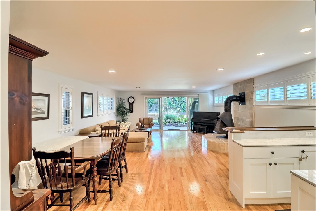 The Huge Entertaining Family Room has a Full Wet Bar with Marble Counter Tops, a Fireplace and opens to the Rear Yard.