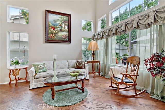 The beautiful living room looking toward back of property