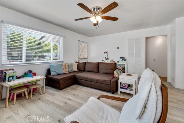 Living Room. Newer dual vinyl windows, ceiling fans, upgraded flooring, cordless blinds