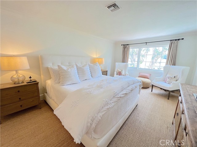 Primary bedroom with king size bed.