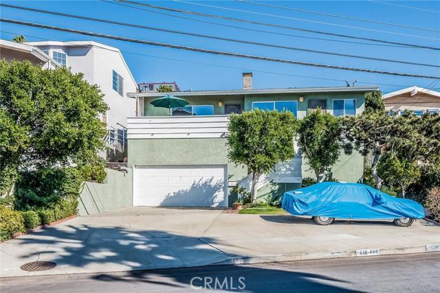 Charming Duplex on a 56' wide elevated lot. Two side by side units with panoramic ocean views and 7-car parking. 3 BR 1.5 Ba unit is on the left with a large front deck. 1 BR 1 Ba unit on the right.