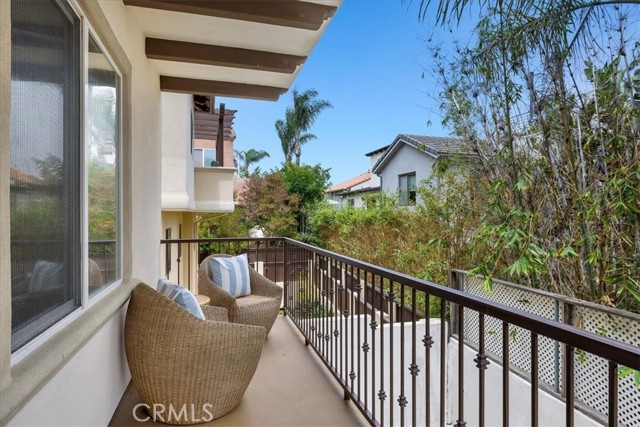 Balcony off primary bedroom expands the length of the house