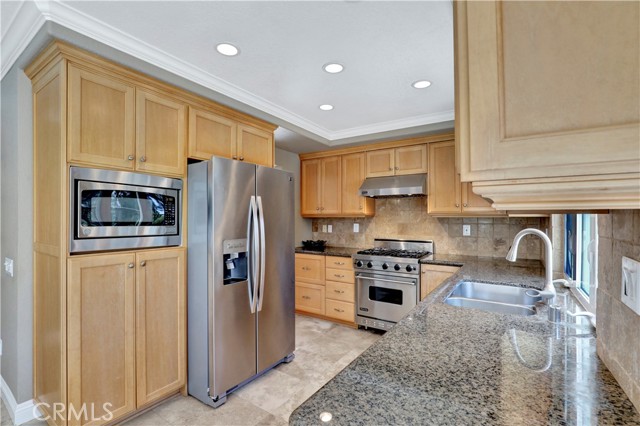 Kitchen wraps around to formal dining room