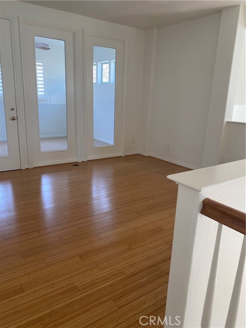 Loft area at the top of stairs with beautiful bamboo floors