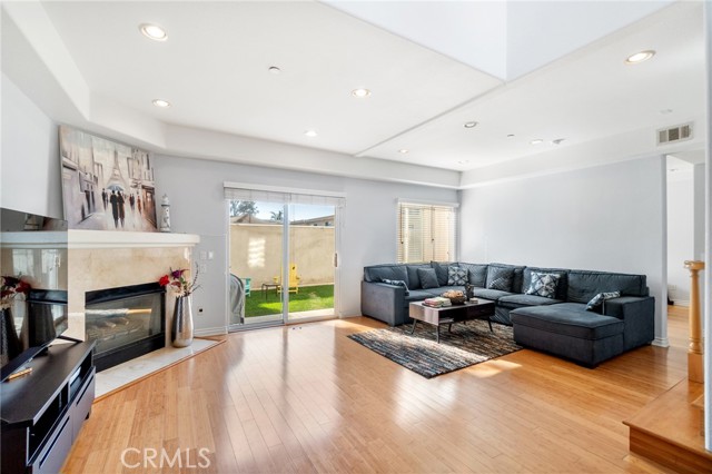 Family Room with fireplace- Sliding doors lead to the yard and outdoor patio