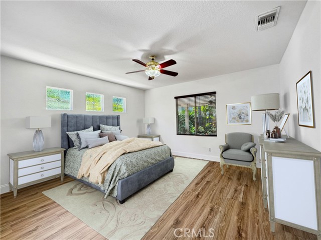 Primary bedroom. Photos depict virtual staging and are not representative of current furnishings in the home.