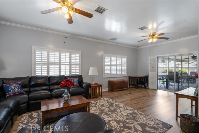 DOUBLE DOORS LEADING TO COVERED PATIO AREA.