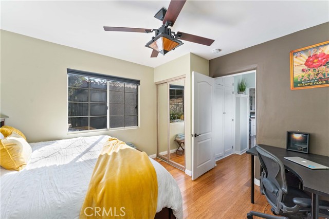 Bedroom #3 has mirrored closet doors and a ceiling fan.