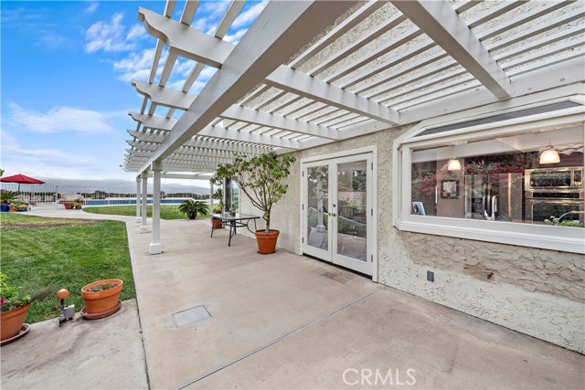 Large side patio with sun shades.