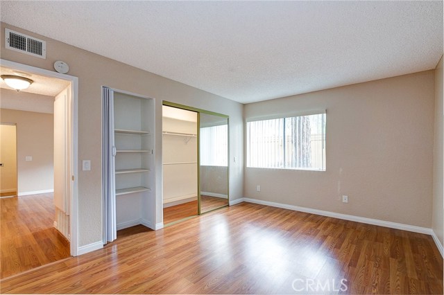 Master bedroom with dual closets... one of which is an oversized closet...