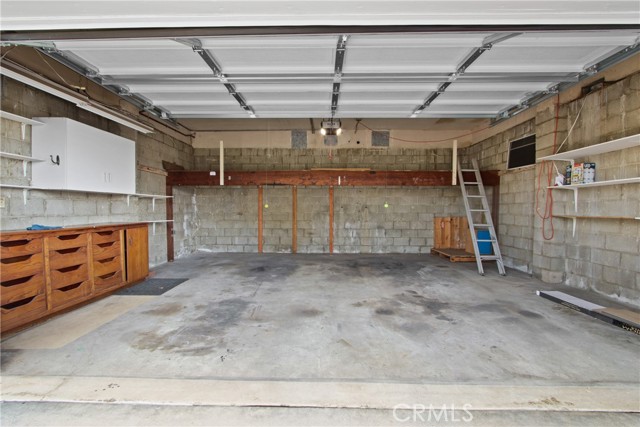 ARDMORE GARAGE WITH A LOT OF SHELVING & 2 CAR PARKING IN FRONT AS WELL