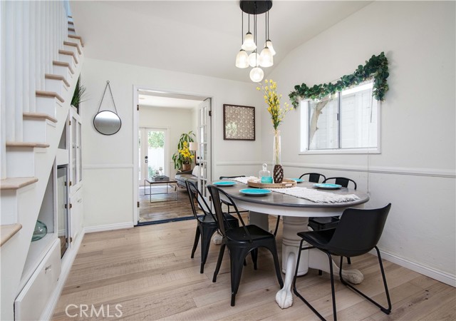 Dining room with wine frig and other built in under the stairs... soooo designer CUTE!