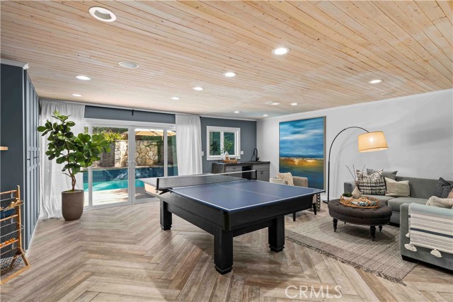 Spacious game room with pool patio access