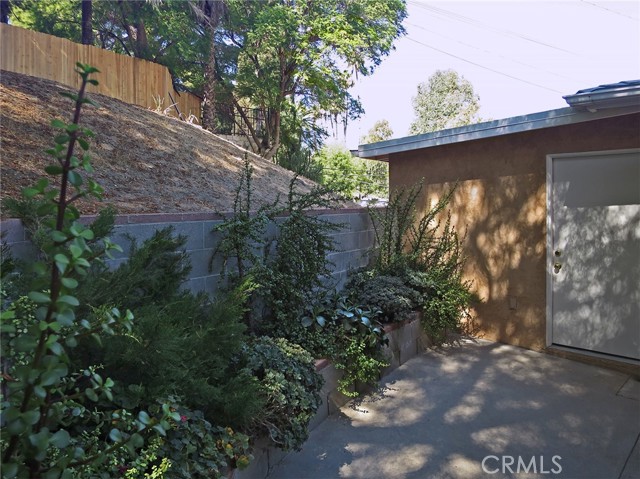 Facing west-northwest, view of back yard and 3rd-car garage (right)