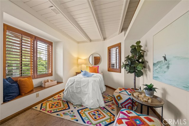 Bedroom #2 with views of center patio & fountain storage & window seat