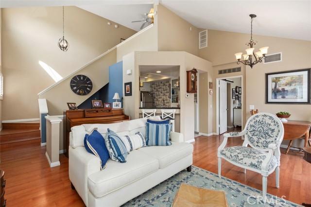 Open-concept living room, kitchen, and dining area.