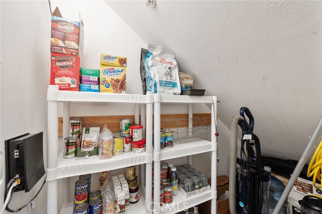 Inside storage room takes advantage of space under the stairs.