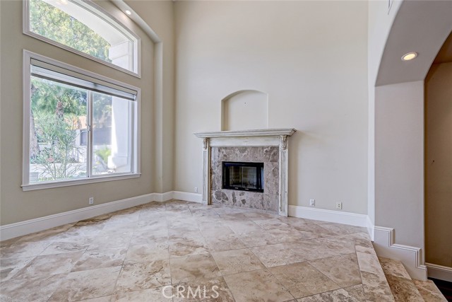 Formal living area also features a fireplace and overlooks the front garden area.