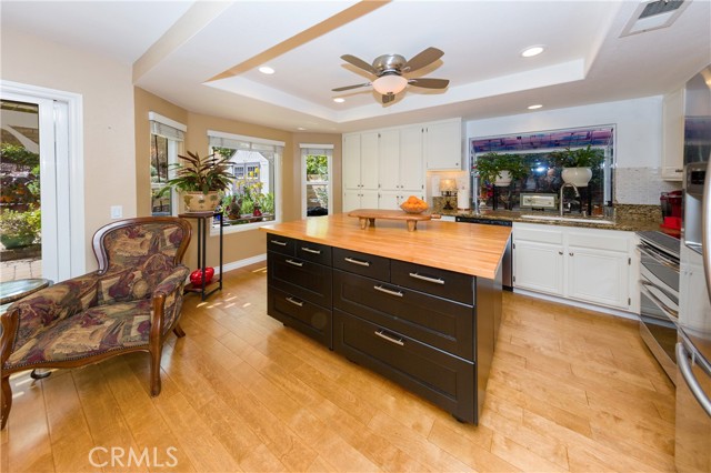 Chef's  kitchen with custom island and storage pantry