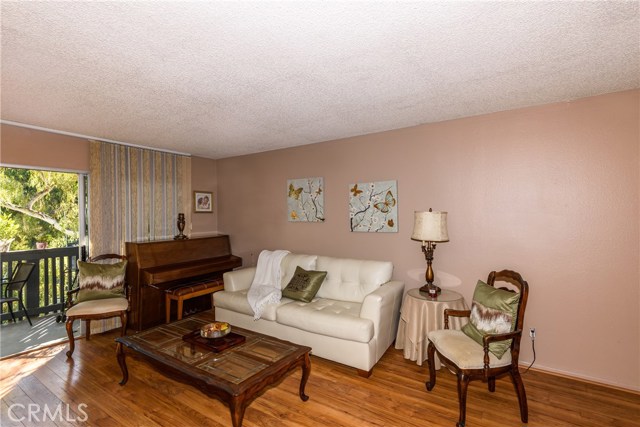 Spacious living room with balcony access.